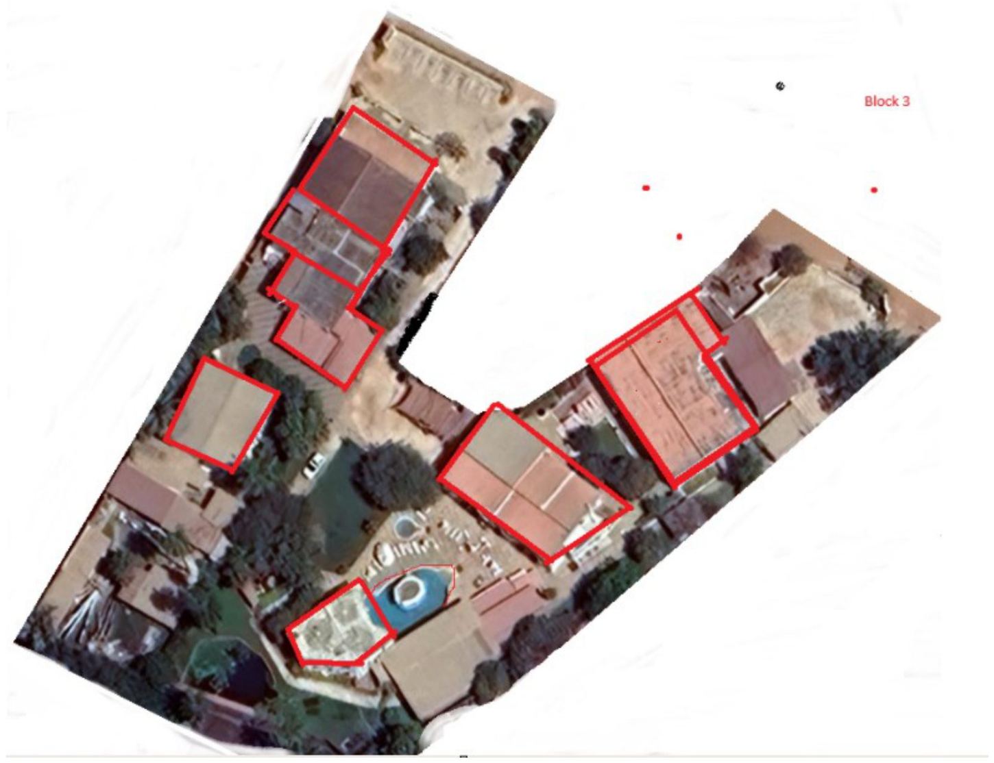 Aerial view of Luigi&rsquo;s Complex: a horseshoe of buildings around the pool